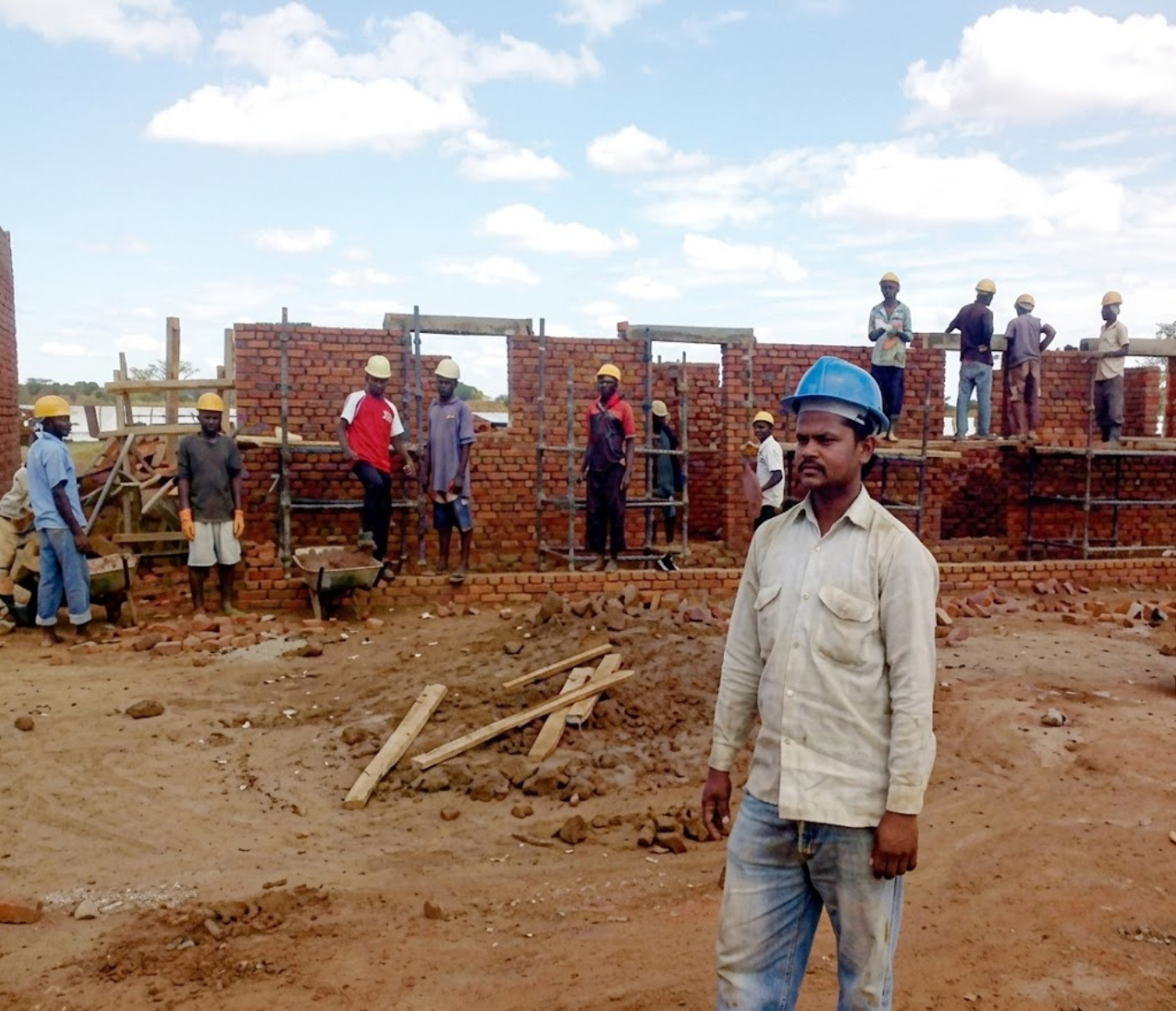 Construction workers coordinating work at a project site